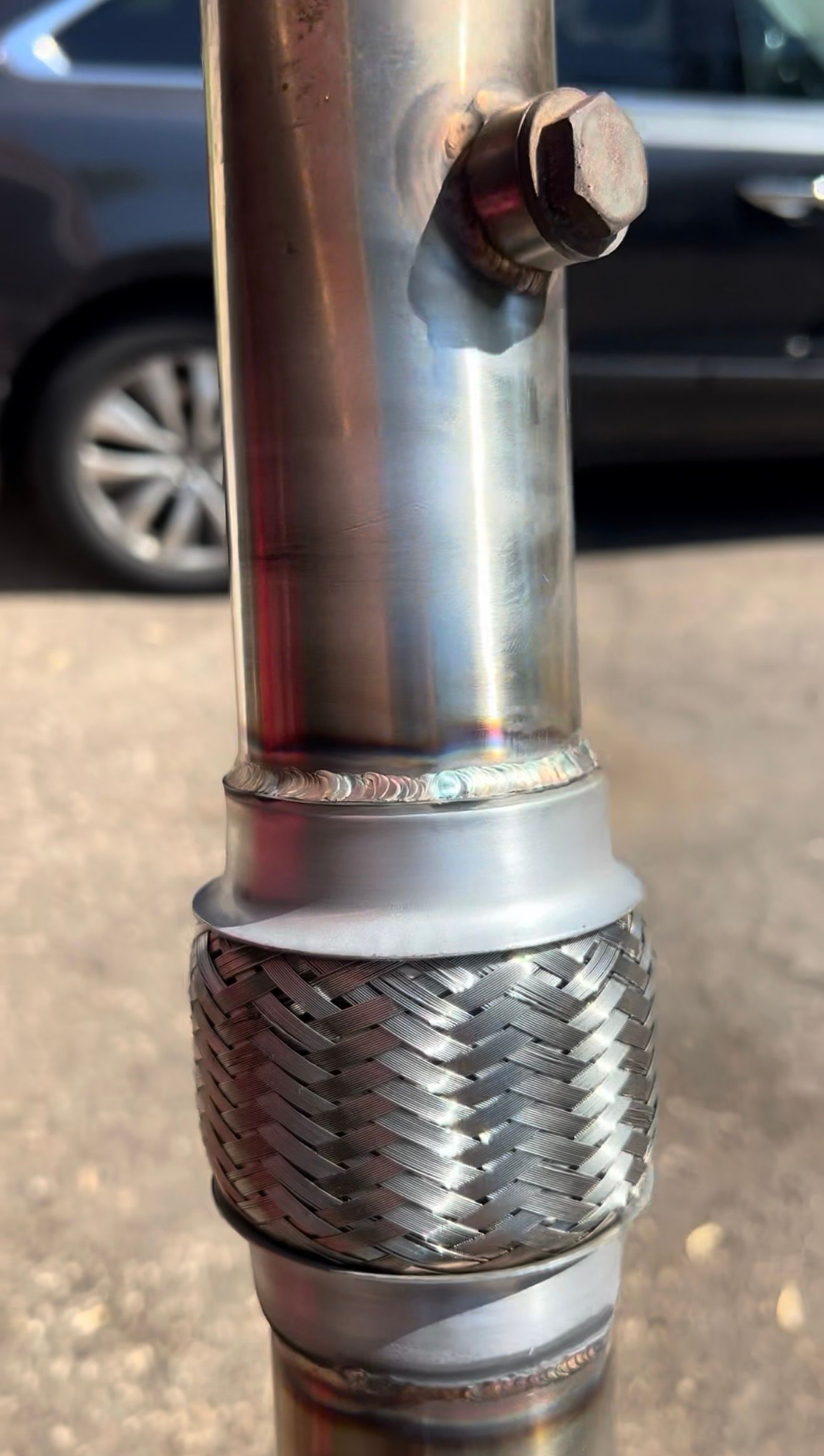 Stainless downpipe section with an O2 bung and a flex section, welded.